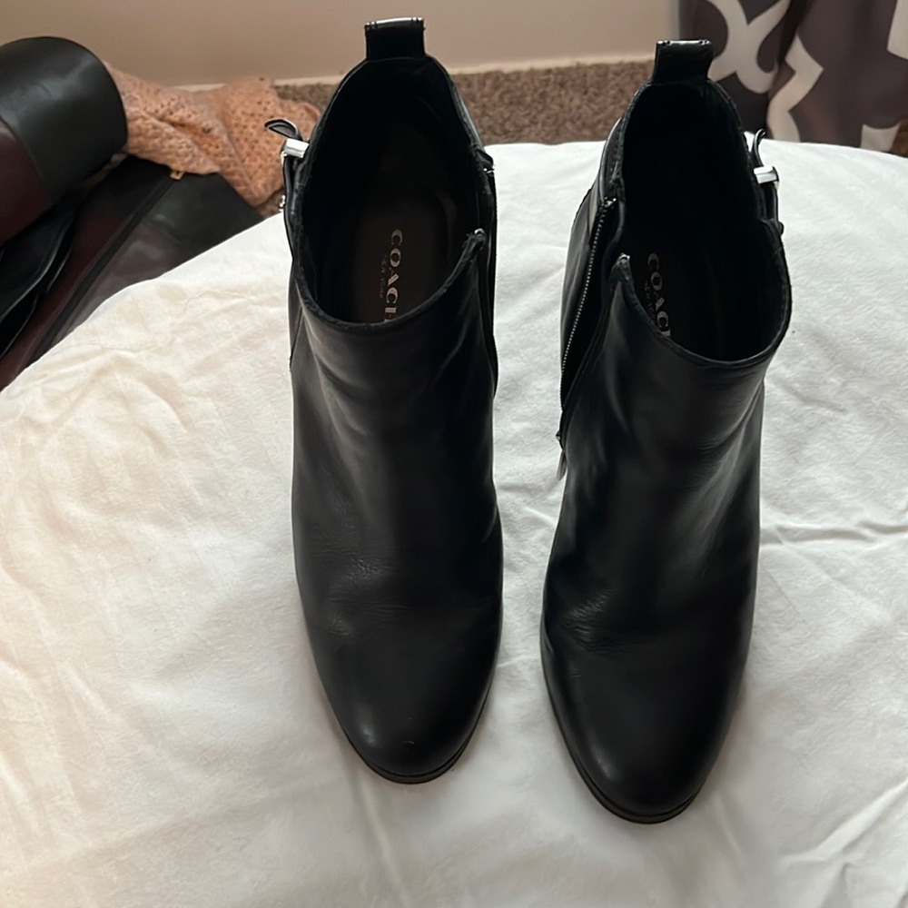 In new condition Coach black booties